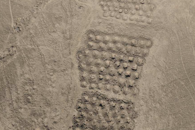 This mountainside is covered in thousands of mysterious ancient holes. Scientists now believe they know why