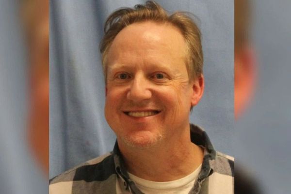 PBS executive seen smiling in mugshot after being arrested on meth charges during traffic stop