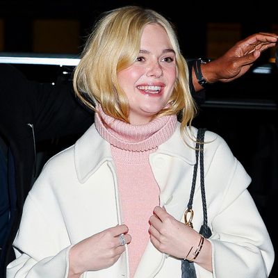 Elle Fanning Proves Why the Dress-Over-Pants Trend Is the Ultimate Winter Layering Idea