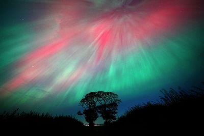 Solar 'cannibal storm' could disrupt communications as Northern Lights appear in UK skies