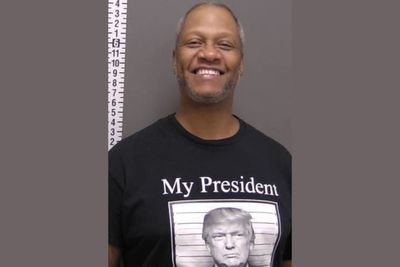 Man charged in drug case smiles proudly after arrest while wearing Trump mugshot T-shirt