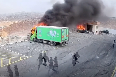 Masked Israeli settlers set fire to vehicles in attack on occupied West Bank