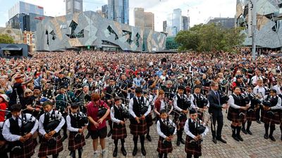 World's largest bagpipe ensemble pays tribute to Bon Scott in Australia as AC/DC break out a classic for the first time in decades