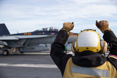 Images of U.S. Navy Sailor Wearing Venezuelan Flag Go Viral as Gerald R. Ford Arrives in Caribbean