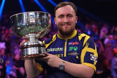 Luke Littler celebrates world number one status by retaining Grand Slam of Darts