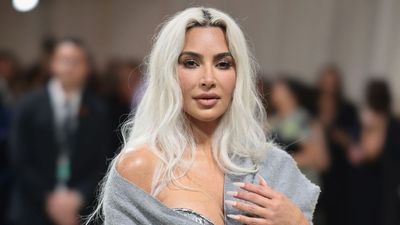 Kim Kardashian’s Minimalist Gift Wrapping Turns Simple White Paper and a Personalized Wax Seal Into a Chic, Luxe Holiday Statement
