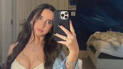 10 Photos of the Viral 'Stunning' Football Fan Who Stole the Show at the Georgia-Texas Game