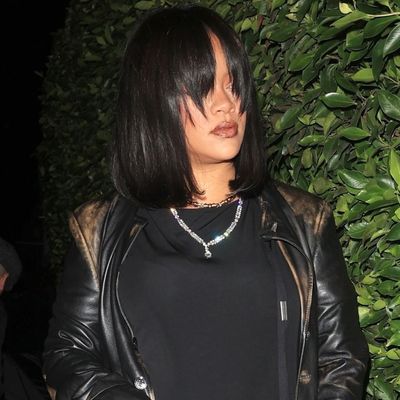 Rihanna Debuts Her New, '90s-Inspired Bangs With an Equally Nostalgic Leather Trench Coat