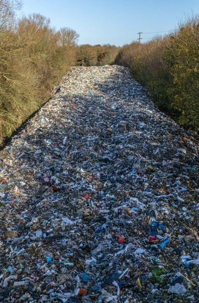Fears as ‘obscene’ fly-tipped rubbish dump drifts closer to river