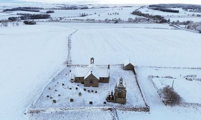 Snow blankets homes in breathtaking drone footage as weather warning issued