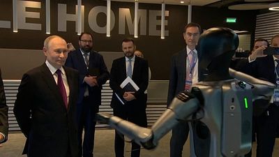 Putin welcomed by dancing robot, announces plan to build 38 new nuclear power units