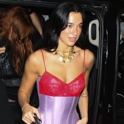 Dua Lipa Perfects Fall's Dark Denim Runway Trend With a Corset Top and a $2,795 Leopard-Print Bag
