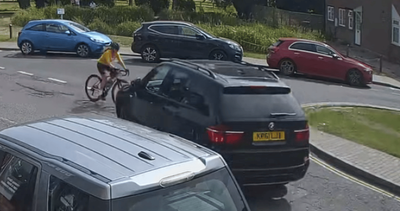 Shocking moment Children In Need chair crashes his BMW into female cyclist in village