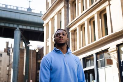 Gen Z men are flocking to quarter-zip pullovers—they’re trying to fake it until they make it in a job market stacked against them