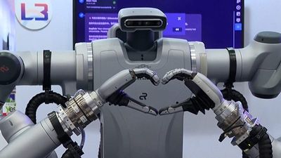 Taiwanese company showcases new electric vehicle and coffee-making humanoid robot