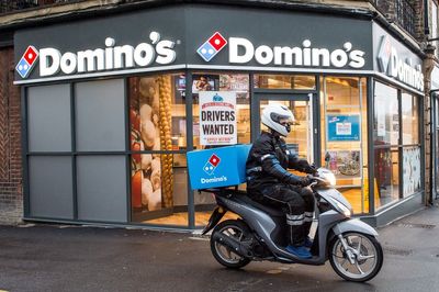 Boss of pizza giant Domino's steps down after boardroom split over chicken move