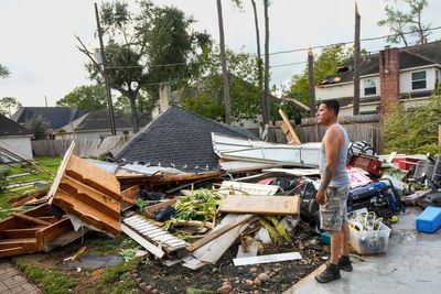 Torn roofs, smashed windows among damage to over 100 homes in a tornado near Houston
