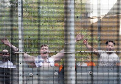 Vulnerable migrants routinely handcuffed and detained for hours, damning report finds