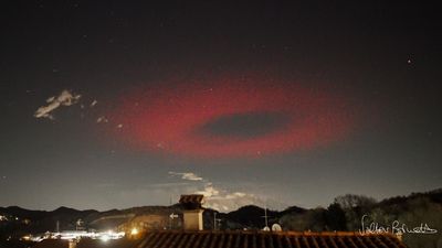 Photographer captures eerie red halo hovering over the Italian Alps in rare 'elve' sighting (photo)
