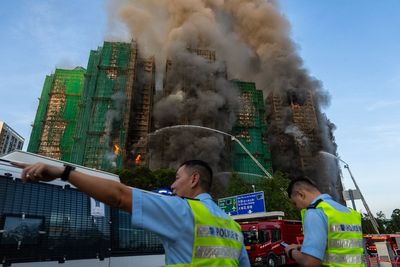 Fire traps people in Hong Kong high-rise with at least 8 people injured