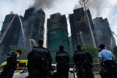 Hong Kong fire latest: Death toll rises to 55 as families try to identify victims after blaze ‘contained’