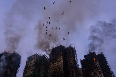 Hong Kong fire latest: Bamboo scaffolding blamed for blaze as death toll rises to 65