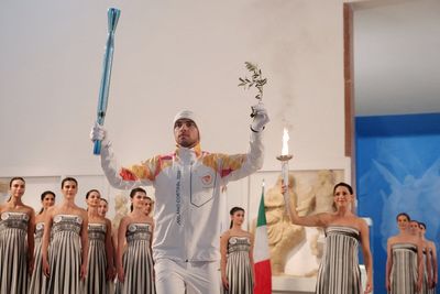 Winter Olympics torch lighting ceremony moved to museum amid bad weather