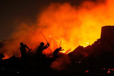 A devastating fire destroys a crowded slum and leaves thousands homeless in Bangladesh capital