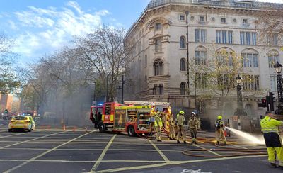 Dozens of firefighters tackle underground fire in central London