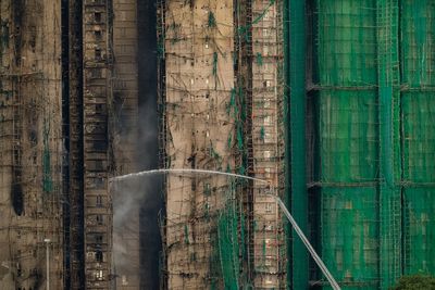 Fire that killed at least 44 burns in Hong Kong towers for a second day