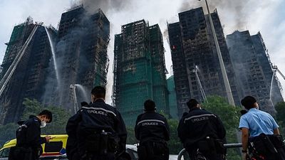 At least 128 killed in Hong Kong blaze as search for scores still missing continues