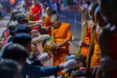 Photos of Buddhist monks in Laos praying in region littered with unexploded bombs