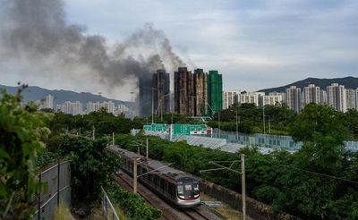 ‘We can’t get any answers’: grief and anger in Hong Kong after deadly high-rise fire
