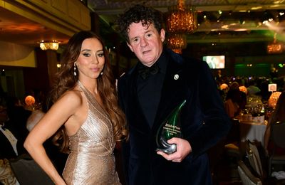 Una Healy presents Outstanding Contribution to Hospitality prize to restaurateur Oisin Rogers at Irish Post Awards