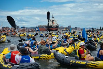 Police charge 11 protesters after climate flotilla prevents coal ship from entering Newcastle harbour