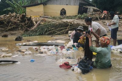Sumatra residents loot for food and water after deadly floods