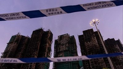 Hong Kong authorities say netting on buildings that caught fire did not meet code