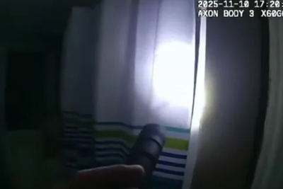 Police officer screams after pulling back shower curtain in basement raid