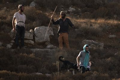 Photos capture West Bank olive harvest as villagers fear more violence by Israeli settlers