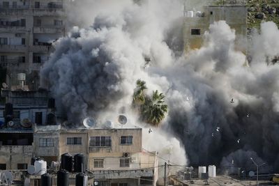 Israeli troops kill a man in Gaza and 2 suspected Palestinian attackers in West Bank