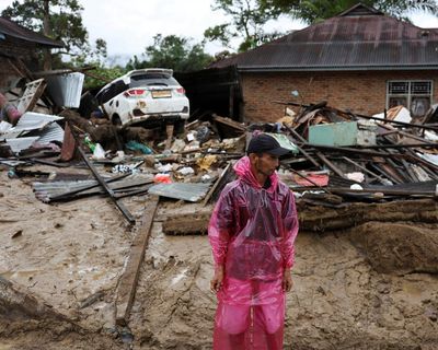 Families on rooftops, homes buried by mud: Asia floods show water is overtaking wind as main threat