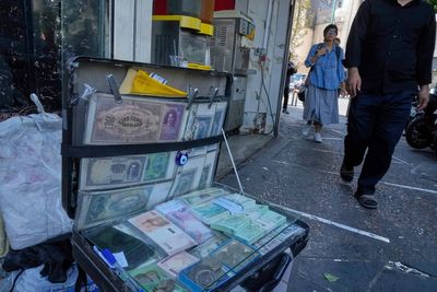 Iran's currency falls to a new low as nuclear sanctions squeeze its ailing economy