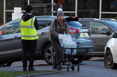 Parents queue for water for children in historic London commuter town hit by 'public health emergency'