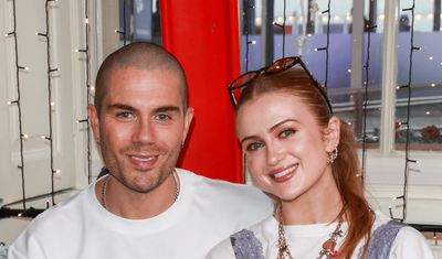 Max George all smiles with girlfriend Maisie Smith at Carmex Christmas cafe in London after heart surgery