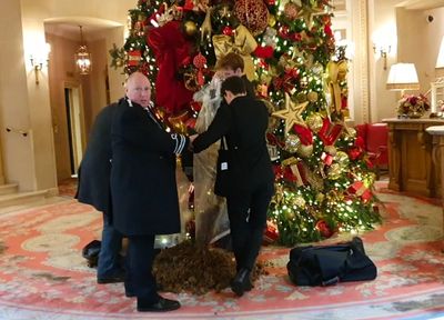 Moment protesters dump manure under Christmas tree at The Ritz Hotel before being dragged away by security