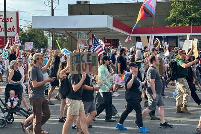 Safety volunteer charged in the fatal shooting of a Utah 'No Kings' protester