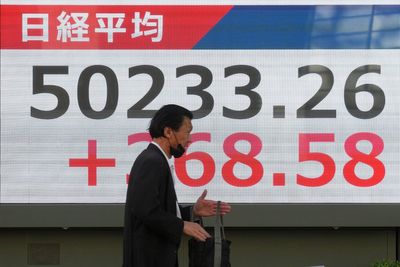 Asian shares are mixed after Wall Street pulls near its all-time high
