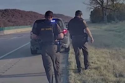 Truck driver faces deportation after unsecured load of tires flies across highway and hits police car