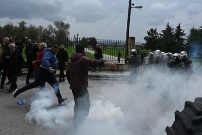 Greek police fire tear gas at protesting farmers threatening to blockade airport
