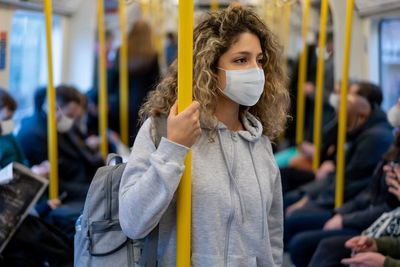 Wear a face mask if unwell to help stem flu ‘tidal wave’, say health officials